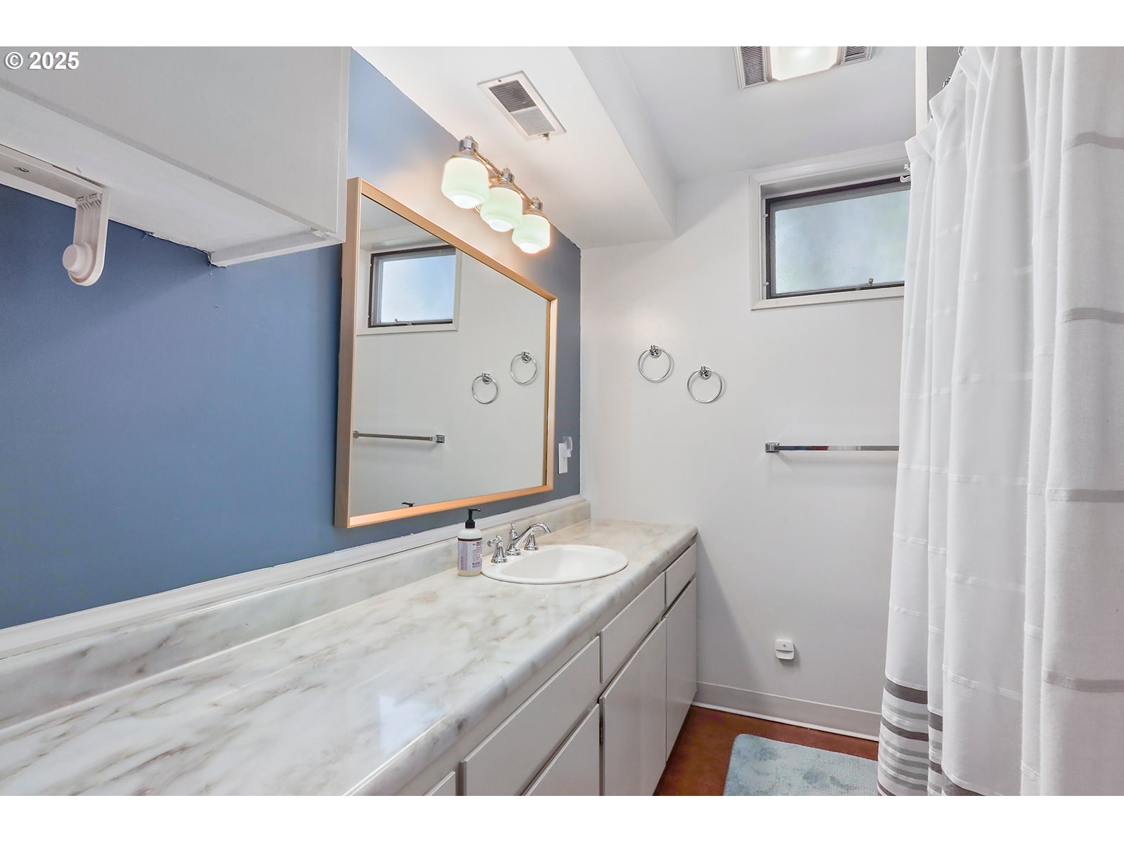 101 Allen Street Carson, WA 98610 - Photo 28 of 48 a bathroom with a sink and a mirror