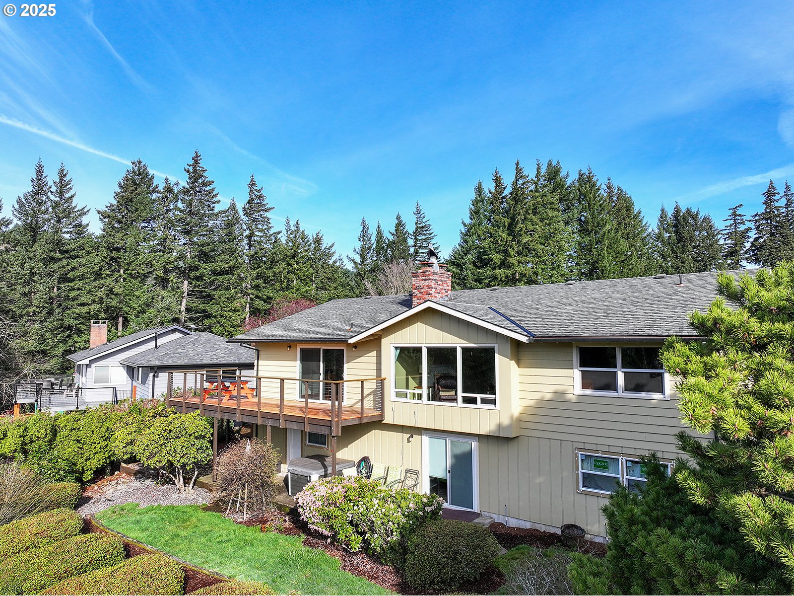101 Allen Street Carson, WA 98610 - Photo 47 of 48 a aerial view of a white house with a yard and potted plants