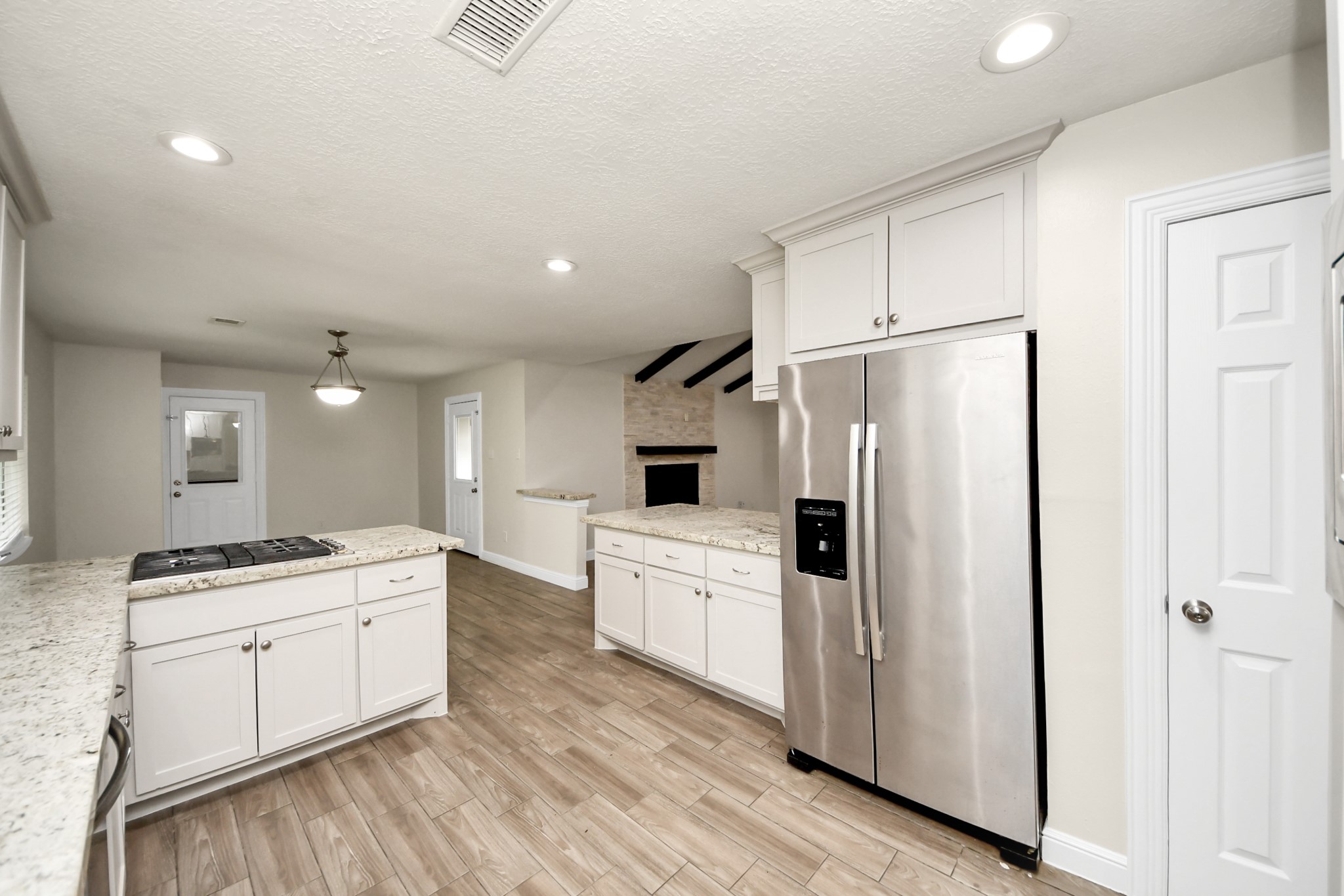 19435 Interstate 45 Spring, TX 77388 - Photo 8 of 24 a kitchen with a refrigerator sink and cabinets