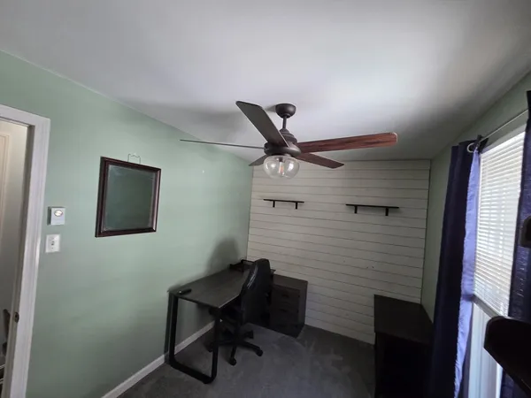 a workspace with furniture and a window