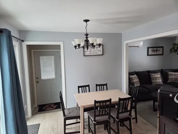 a dining room with furniture and window