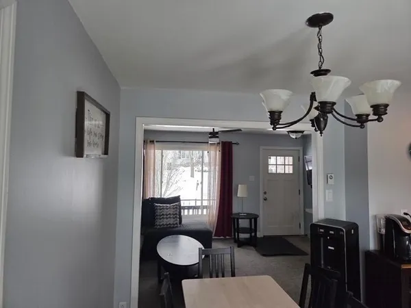 a view of a livingroom with furniture and window