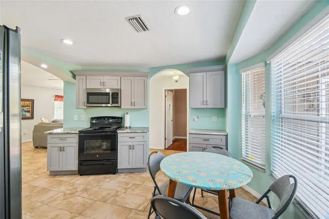 a dining room with a table and chairs