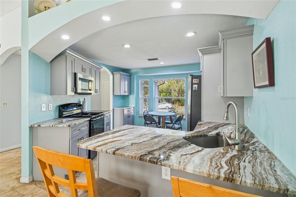 13170 Pirate Lane Spring Hill, FL 34609 - Photo 18 of 83 a bed room with a bed furniture and a window