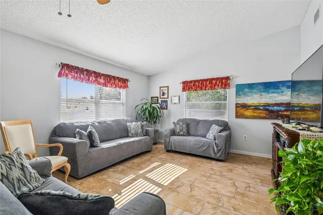 a bedroom with a bed and a television