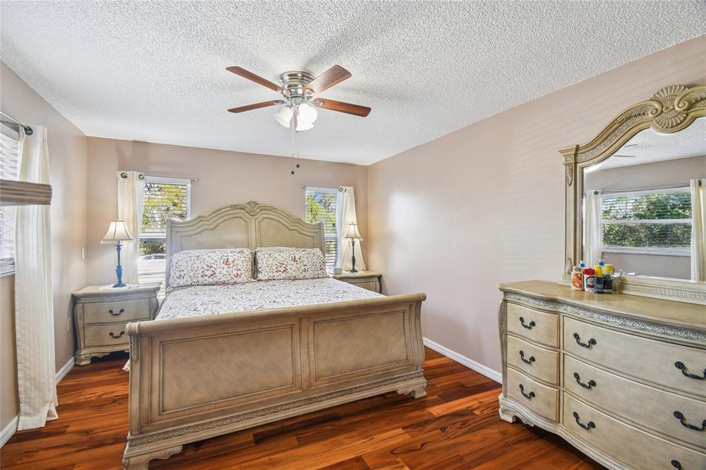 13170 Pirate Lane Spring Hill, FL 34609 - Photo 35 of 83 a bedroom with a bed and a dresser