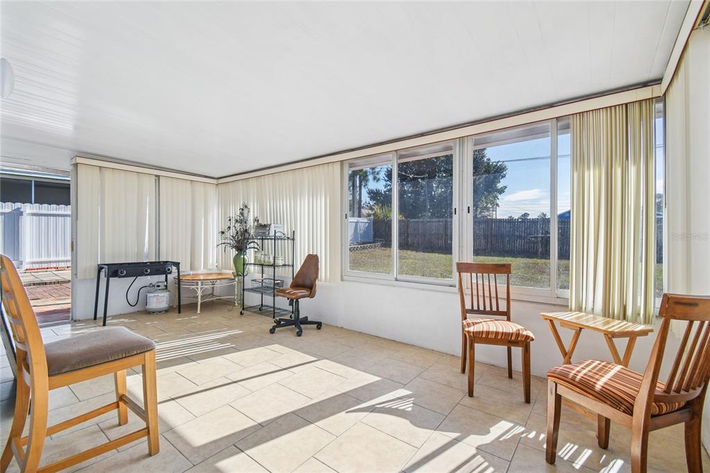 13170 Pirate Lane Spring Hill, FL 34609 - Photo 49 of 83 a living room with furniture and a window