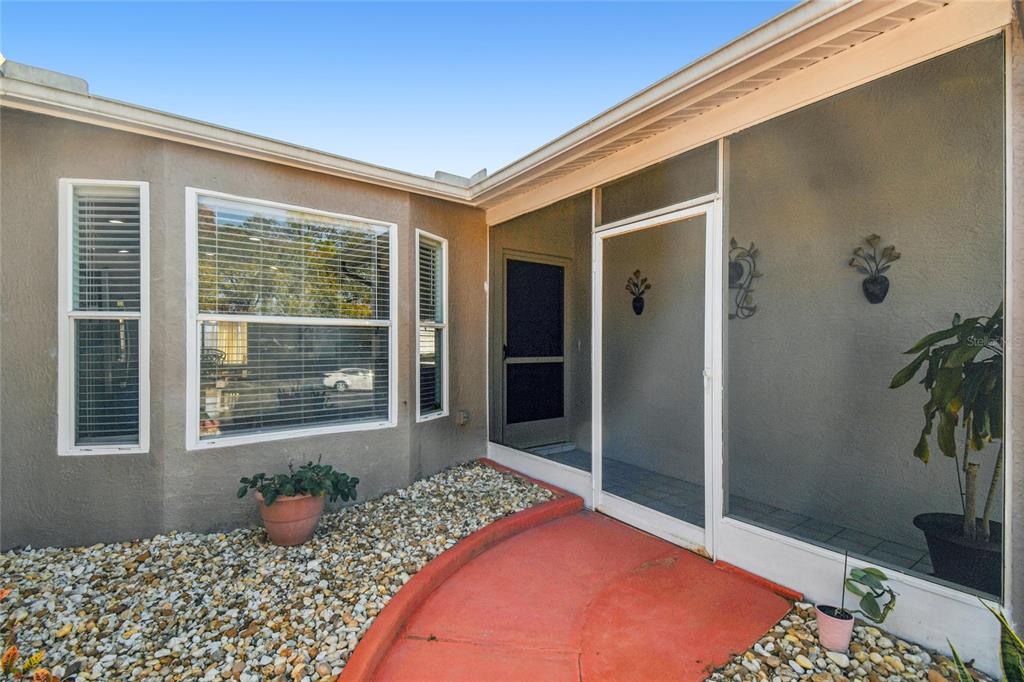 13170 Pirate Lane Spring Hill, FL 34609 - Photo 6 of 83 a bedroom with a bed and wooden floor