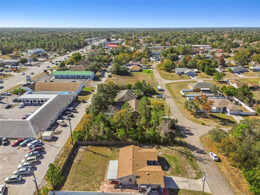 13170 Pirate Lane Spring Hill, FL 34609 - Photo 74 of 83 an aerial view of residential houses with outdoor space