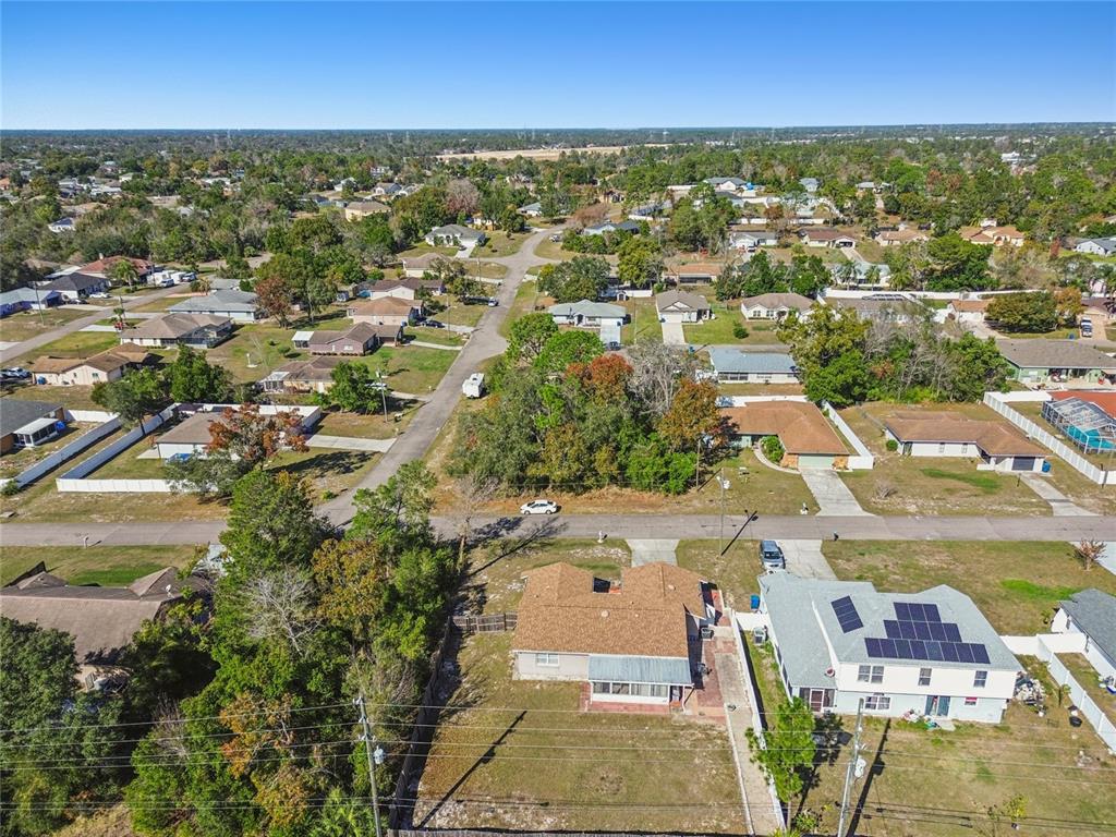 13170 Pirate Lane Spring Hill, FL 34609 - Photo 76 of 83 an aerial view of residential houses with outdoor space