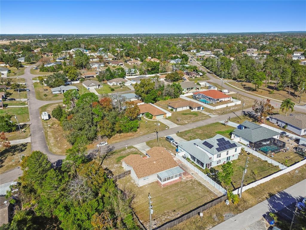 13170 Pirate Lane Spring Hill, FL 34609 - Photo 77 of 83 an aerial view of residential houses with outdoor space