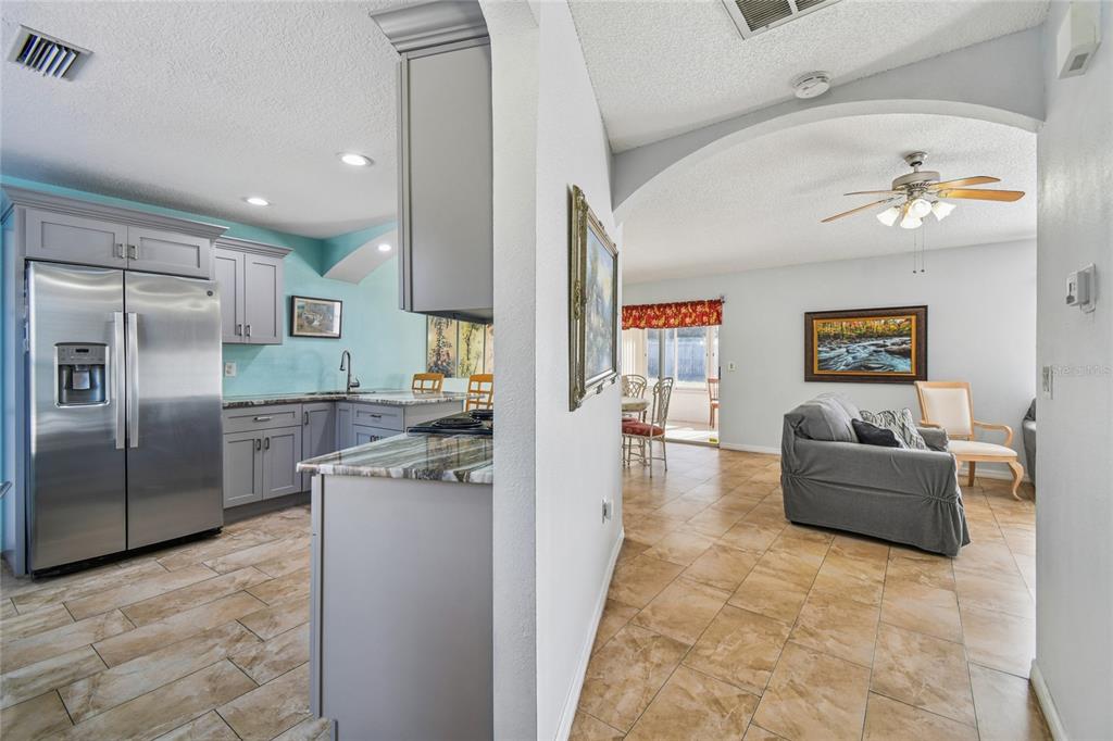 13170 Pirate Lane Spring Hill, FL 34609 - Photo 9 of 83 a kitchen with stainless steel appliances granite countertop a refrigerator and a sink