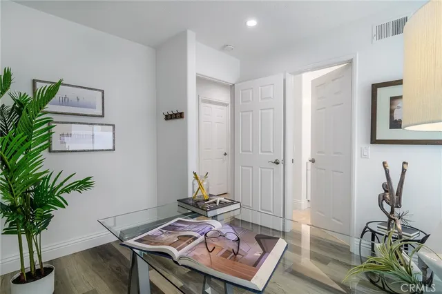 a living room with furniture and potted plant