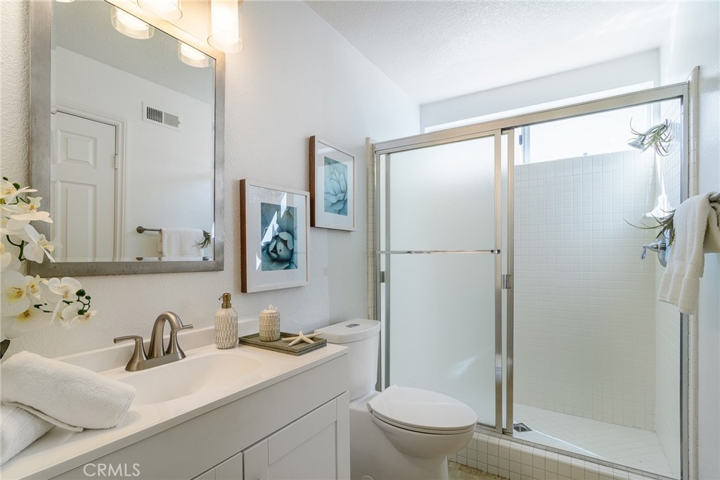 5 Telliz Rancho Santa Margarita, CA 92688 - Photo 27 of 58 a bathroom with a sink toilet and shower