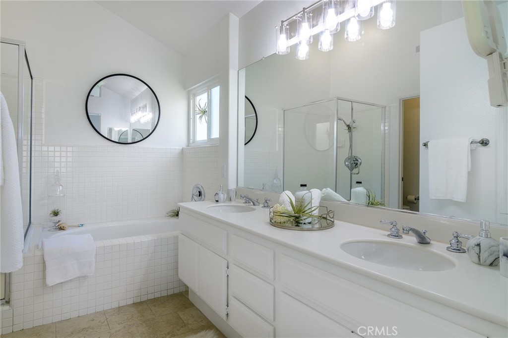 5 Telliz Rancho Santa Margarita, CA 92688 - Photo 34 of 58 a bathroom with a double vanity sink and a mirror