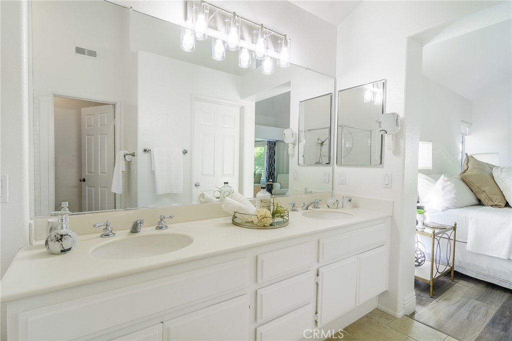 5 Telliz Rancho Santa Margarita, CA 92688 - Photo 36 of 58 a bathroom with double vanity sinks and a mirror