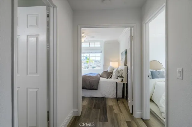 a bedroom with a bed and a dresser in it