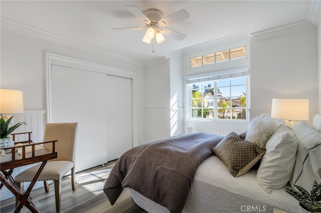 5 Telliz Rancho Santa Margarita, CA 92688 - Photo 39 of 58 a bedroom with a bed and a chandelier