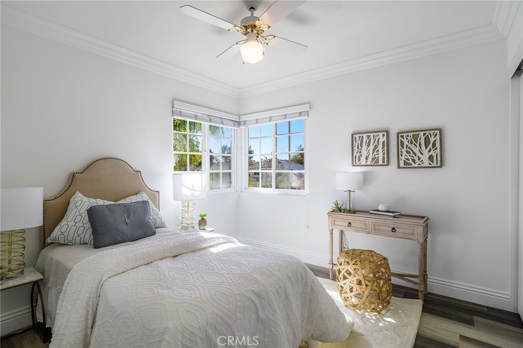 5 Telliz Rancho Santa Margarita, CA 92688 - Photo 41 of 58 a bedroom with a bed and a chandelier