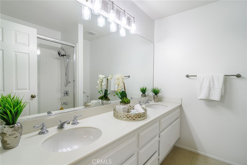 5 Telliz Rancho Santa Margarita, CA 92688 - Photo 42 of 58 a bathroom with a sink and a mirror