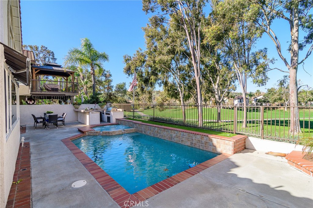 5 Telliz Rancho Santa Margarita, CA 92688 - Photo 49 of 58 a swimming pool with outdoor seating and yard