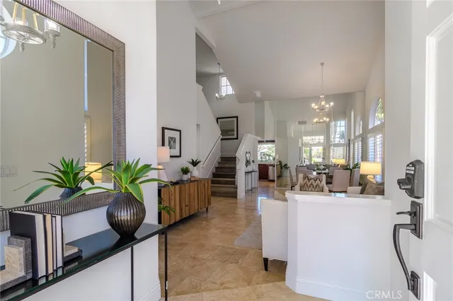 a lobby with furniture and a potted plant