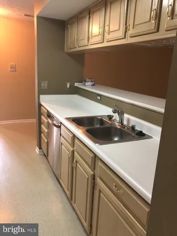 a kitchen with a stove microwave and refrigerator