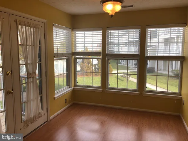 a view of a chandelier fan and closet in a room