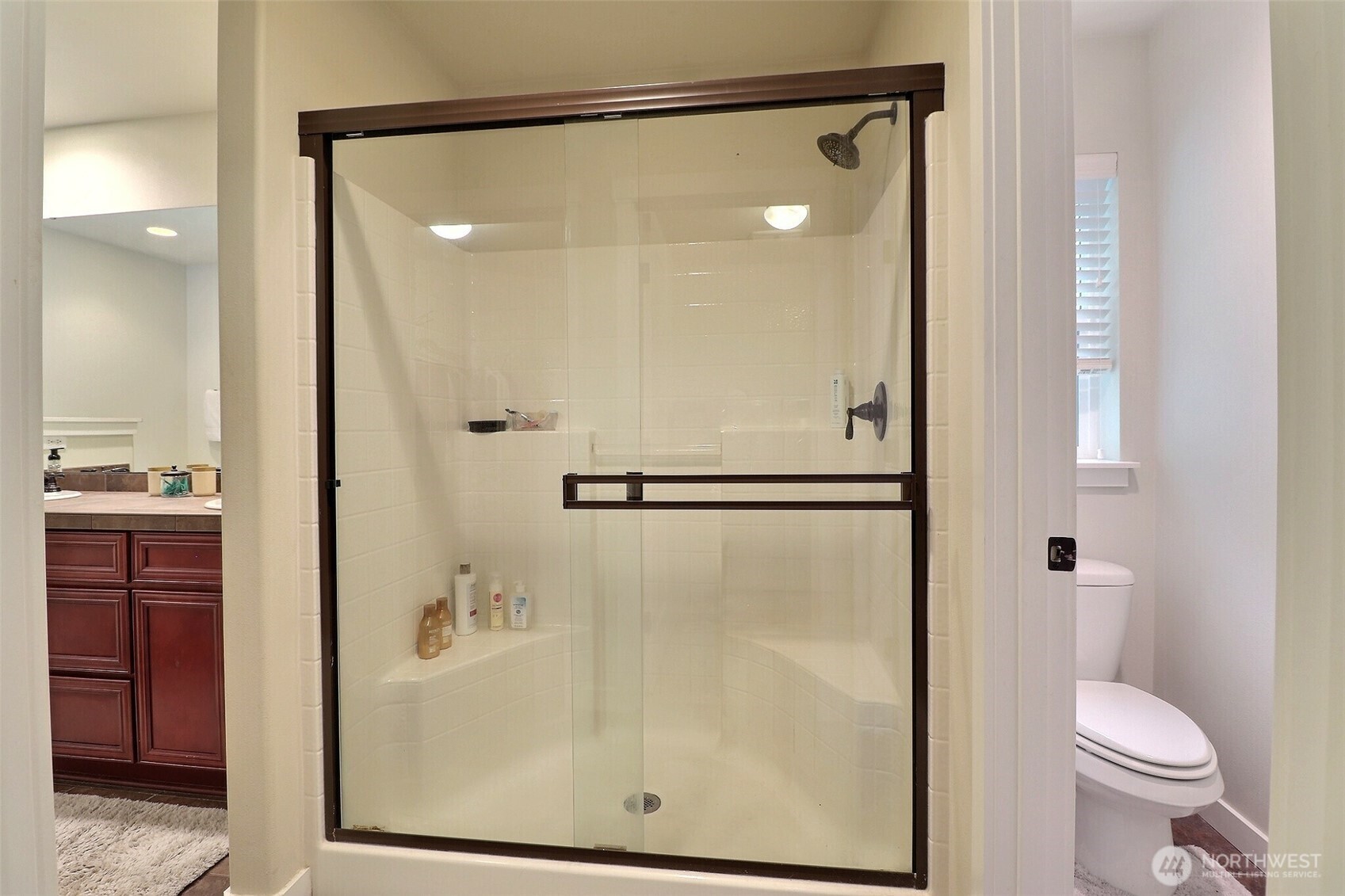19776 Mountain Ridge Road Southeast Monroe, WA 98272 - Photo 22 of 40 a bathroom with a shower a toilet and a sink