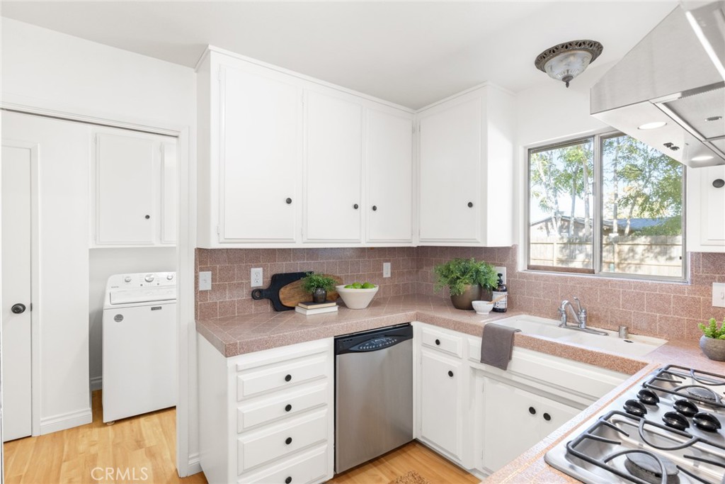 8 Cottage Circle Chico, CA 95926 - Photo 14 of 46 a kitchen with white cabinets and window