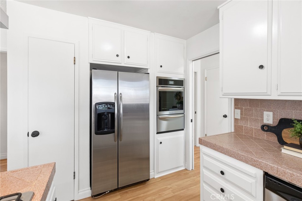 8 Cottage Circle Chico, CA 95926 - Photo 16 of 46 a kitchen with stainless steel appliances granite countertop a refrigerator and a sink