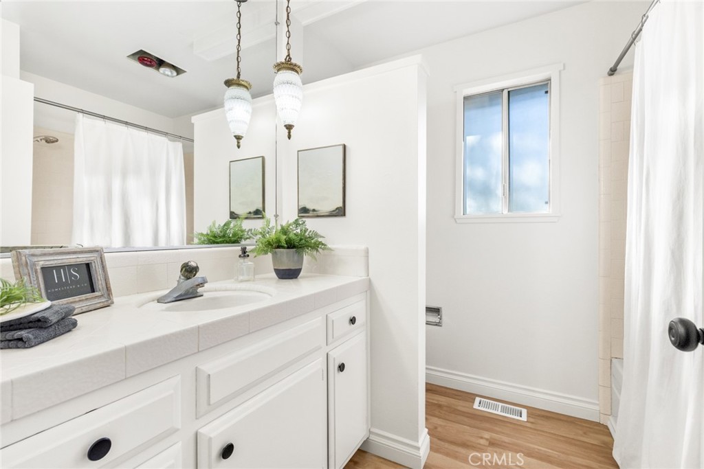 8 Cottage Circle Chico, CA 95926 - Photo 23 of 46 a bathroom with a sink and a mirror