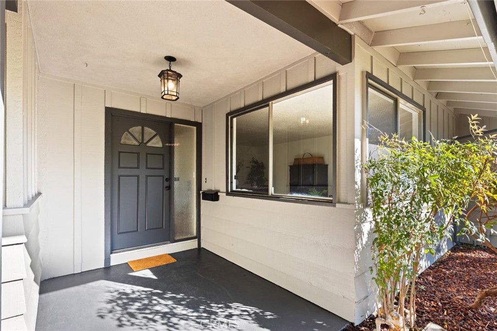 8 Cottage Circle Chico, CA 95926 - Photo 33 of 46 a view of a hallway with a chandelier and wooden floor