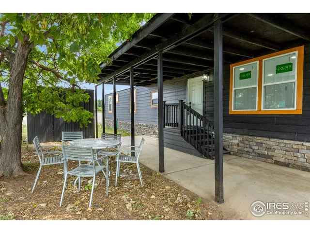 a patio with table and chairs