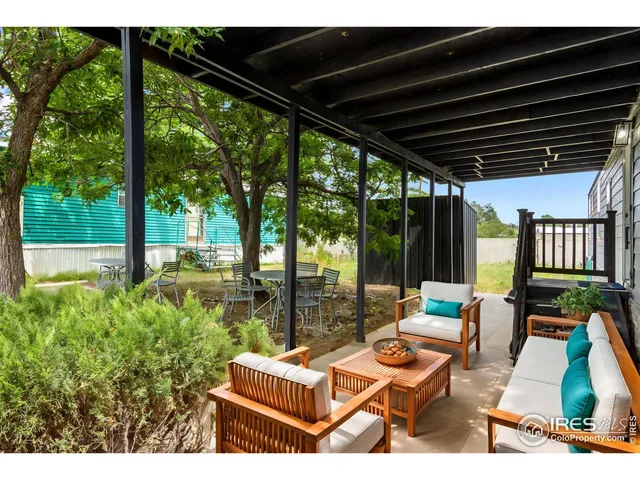 a backyard of a house with seating space