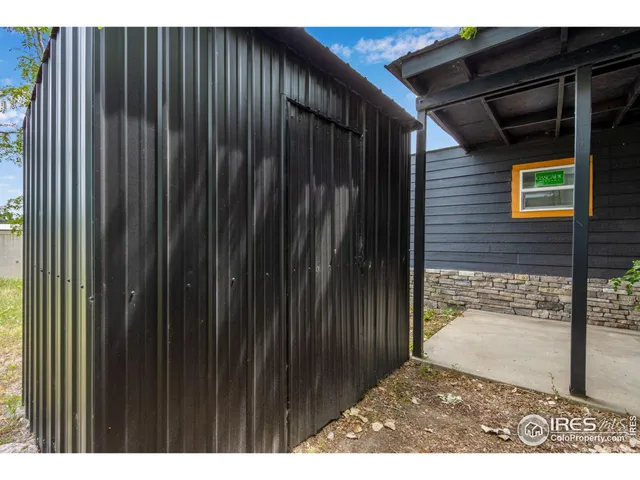 a view of backyard with cabin