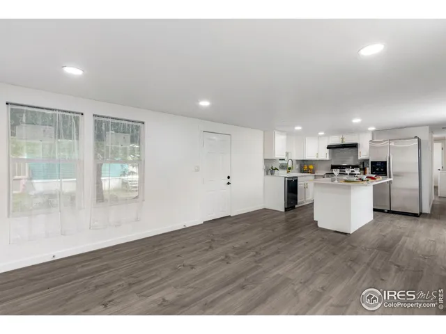 a view of kitchen with wooden floor