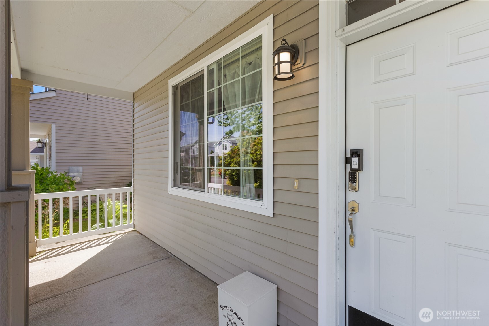 8305 Sweetbrier Loop Southeast Olympia, WA 98513 - Photo 8 of 40 a view of a porch with a table and chair