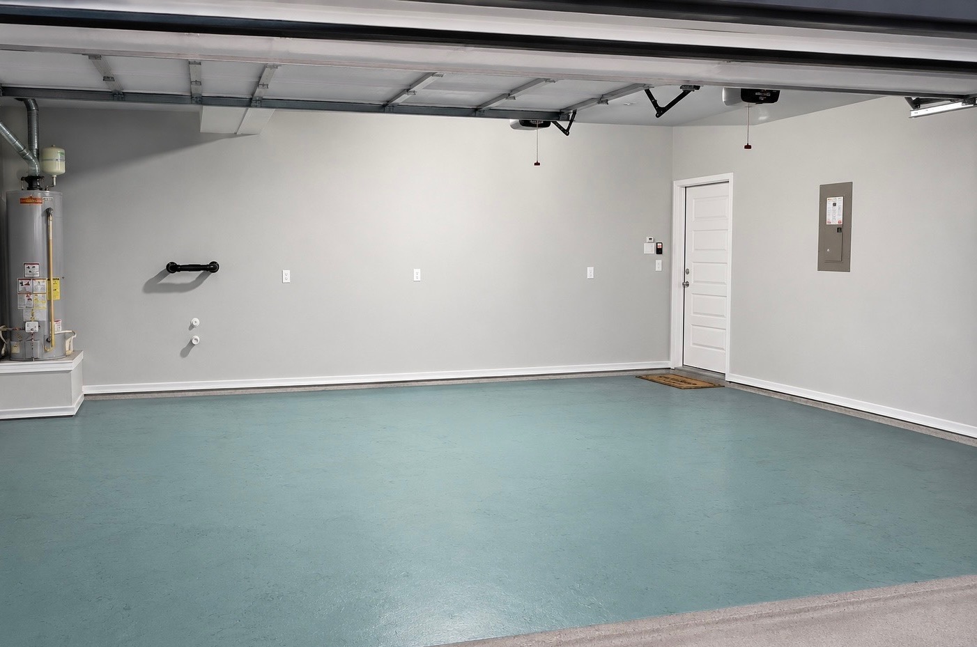 508 Rearing Mare Pass Georgetown, TX 78626 - Photo 18 of 24 A spacious and clean garage with an appealing light blue floor and ample utility hookups.