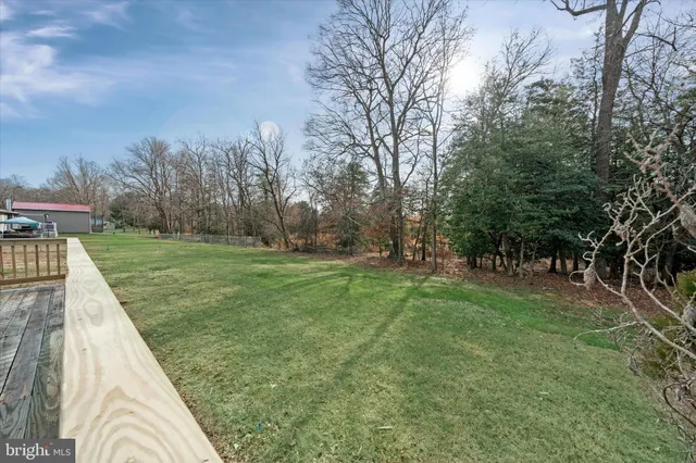 a view of a backyard with green space