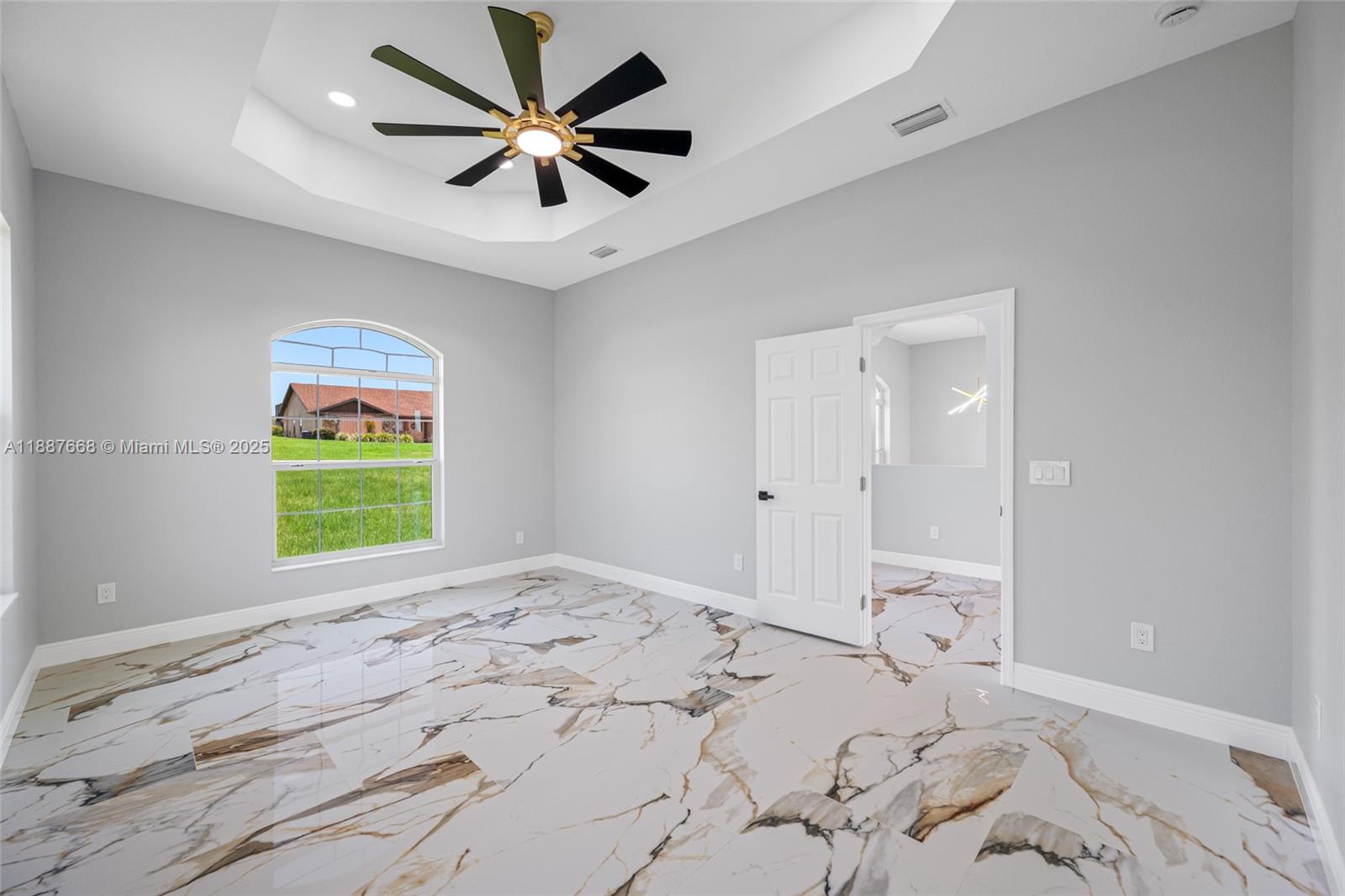 5317 Lydia Court Spring Hill, FL 34608 - Photo 5 of 10 wooden floor in an empty room with a window