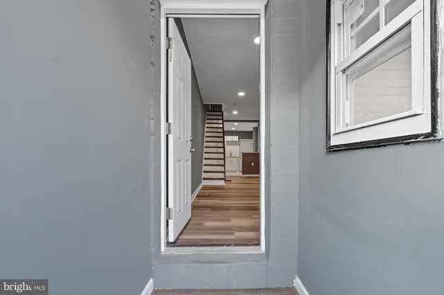 a view of a hallway with stairs