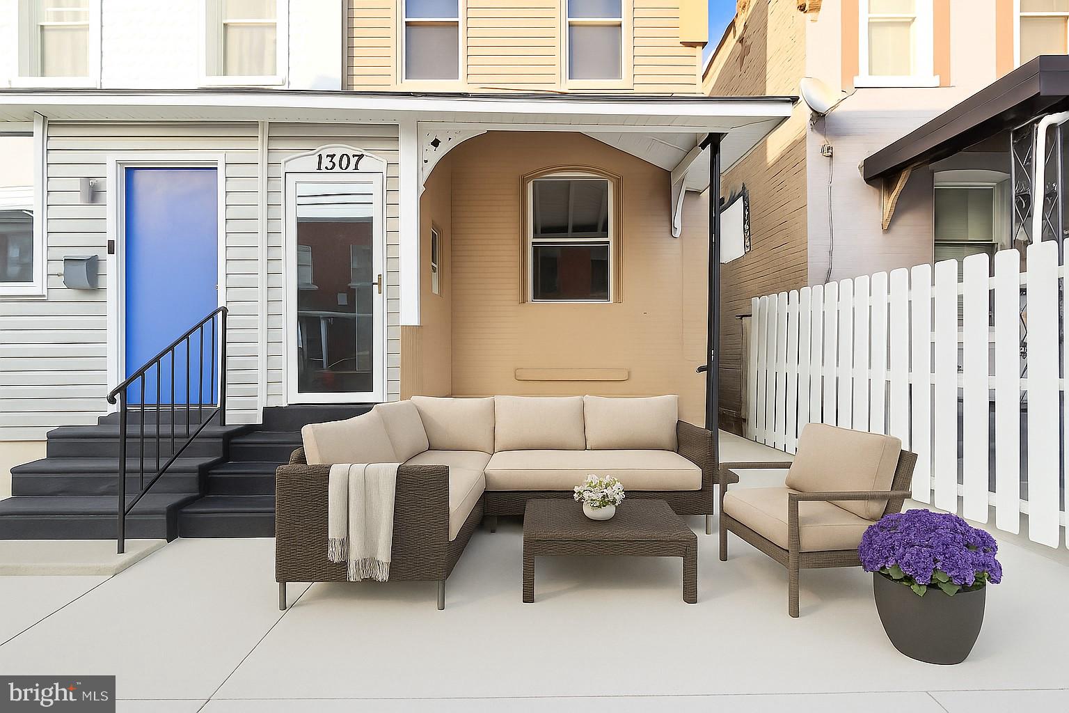 1307 Hanson Street Philadelphia, PA 19143 - Photo 19 of 19 a front view of a house with outdoor seating