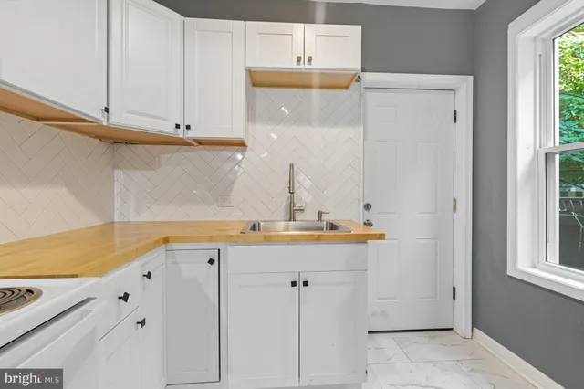 a view of cabinets with wooden floor