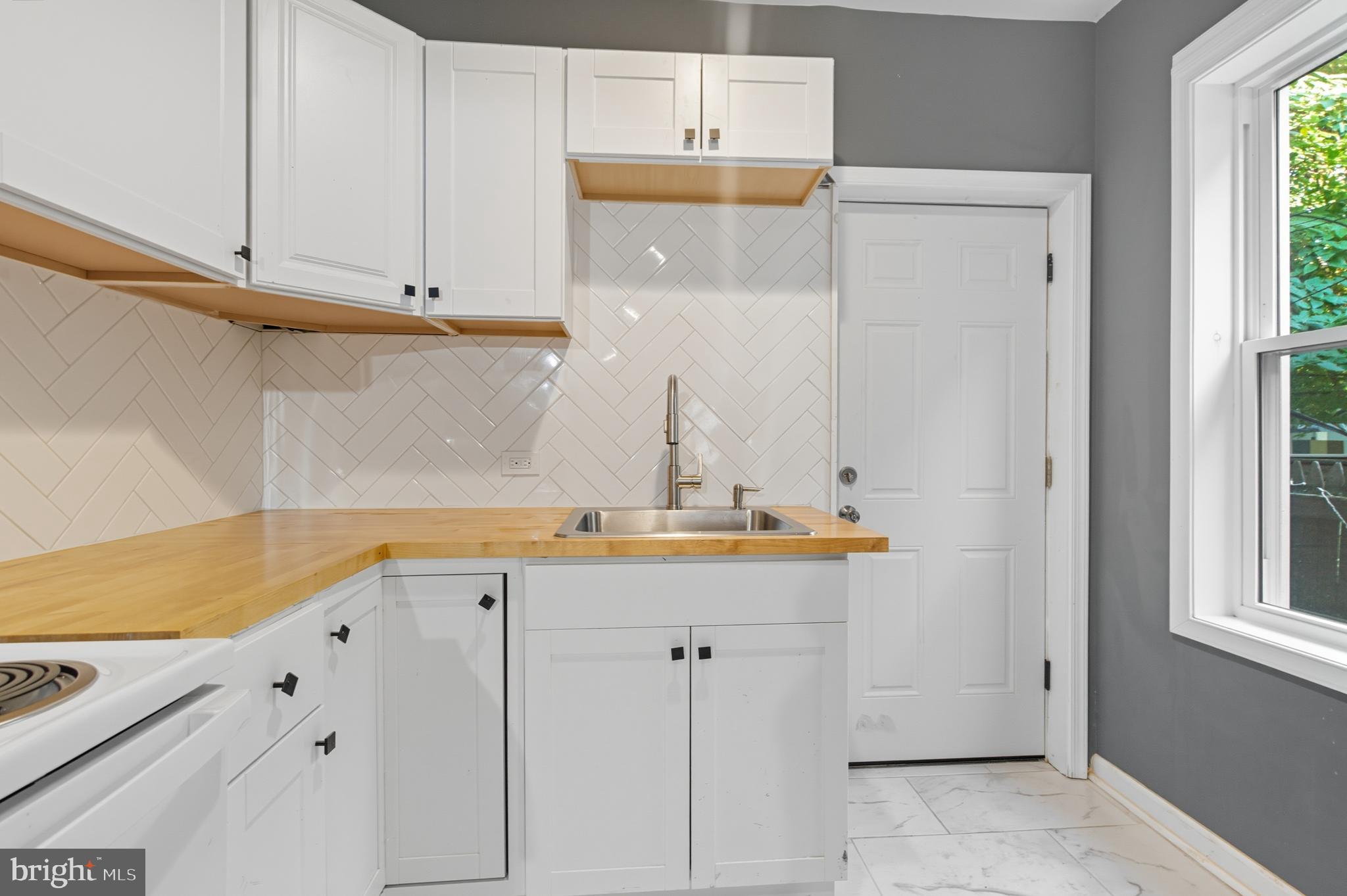1307 Hanson Street Philadelphia, PA 19143 - Photo 6 of 19 a view of cabinets with wooden floor
