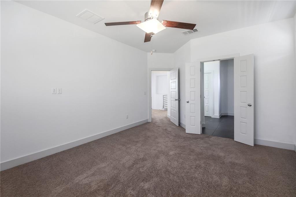 5809 Swayden Lane Austin, TX 78745 - Photo 7 of 10 Main Bedroom, high ceilings, full bathroom with separate shower and large walk in closet