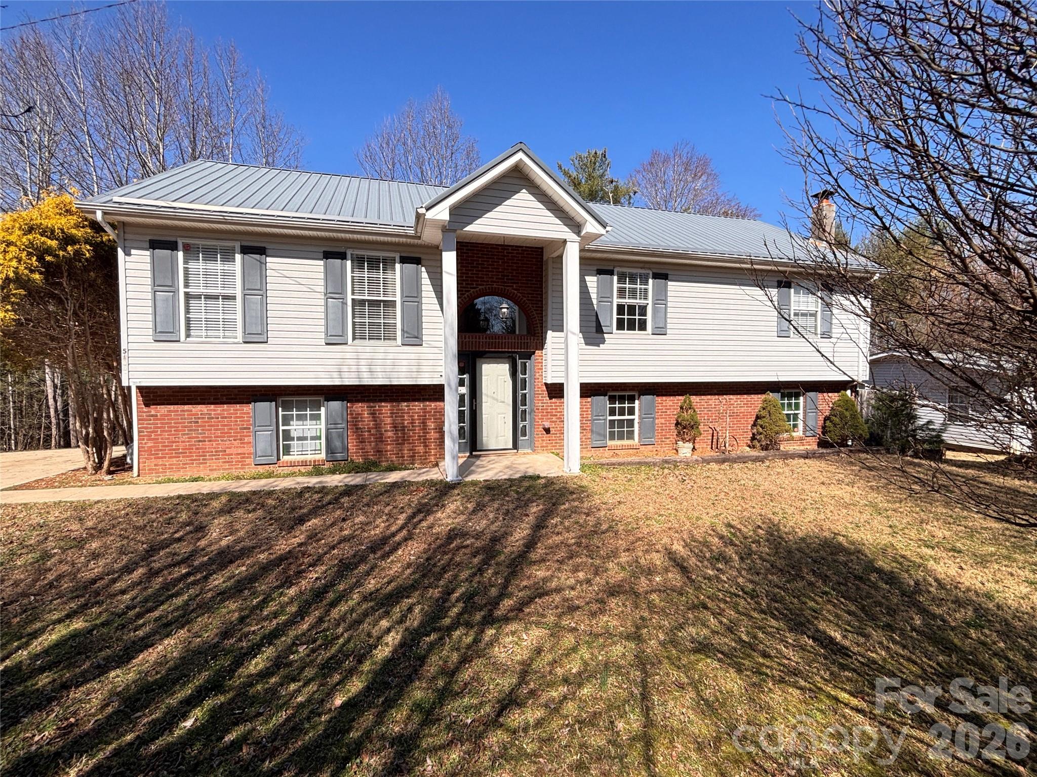 5164 Ralph Winchester Road Lenoir, NC 28645 - Photo 1 of 20 a front view of a house with a yard