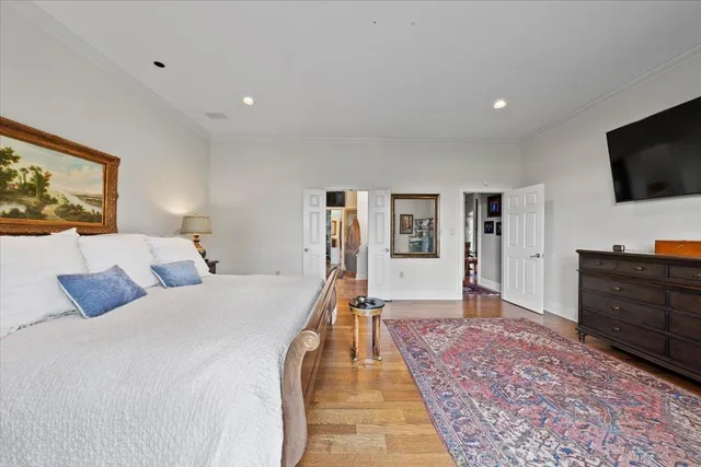 a bed room with a bed and a television