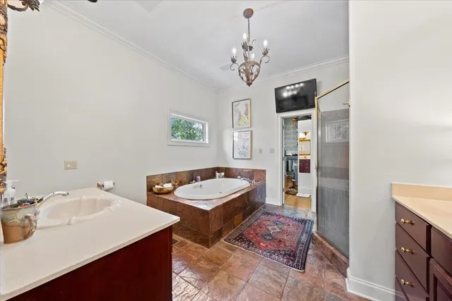 a spacious bathroom with a sink a large mirror and a shower