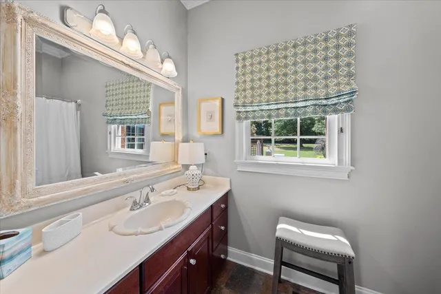 a bathroom with a sink and a mirror